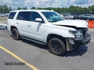 2020 Chevrolet Tahoe Commercial z VIN 1GNLCDEC4LR246474, wystawiony jako IAAI lot #42607484 z przebiegiem 107 910 mil mil oraz . Historia ofert i sprzedaży dostępna na DreamBid. Obrazek 1.