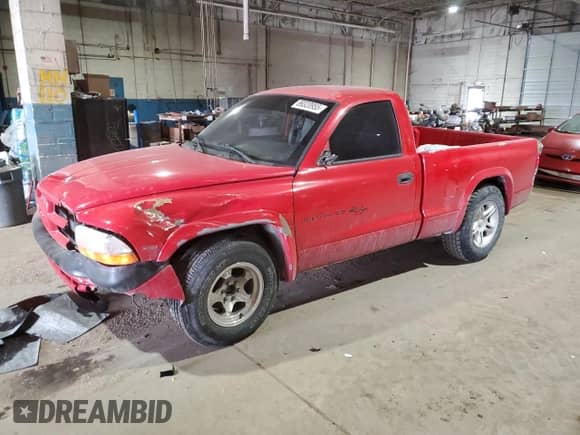 1999 Dodge Dakota SLT with VIN 1B7GL26Z4XS233613, listed as a Copart auction lot 89320955 with 221,289 mi miles and Clean title. Bid and sale history available at DreamBid. Image 1.