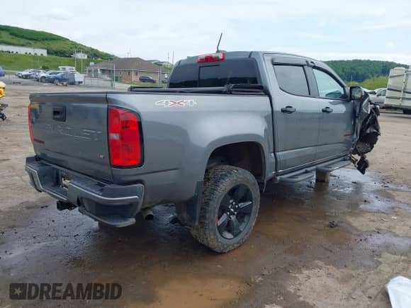 2021 Chevrolet Colorado 4WD LT with VIN 1GCGTCEN1M1105688, listed as a IAAI auction lot 42390000 with 59,181 mi miles and . Bid and sale history available at DreamBid. Image 4.