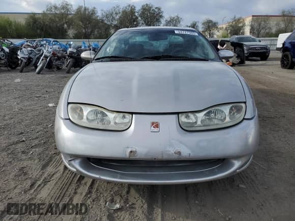 2001 Saturn SC with VIN 1G8ZY14701Z255767, listed as a Copart auction lot 53727985 with 137,776 mi miles and Salvage title. Bid and sale history available at DreamBid. Image 5.
