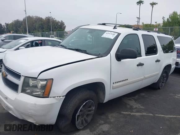 2007 Chevrolet Suburban LTZ z VIN 1GNFC16077R223342, wystawiony jako IAAI lot #42513496 z przebiegiem 256 637 mil mil oraz . Historia ofert i sprzedaży dostępna na DreamBid. Obrazek 16.