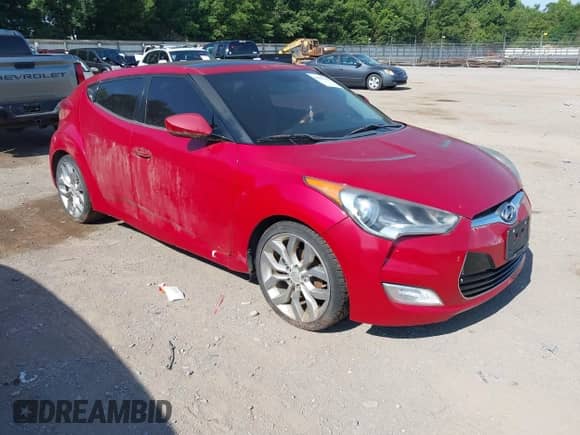 2012 Hyundai Veloster w/Black Int z VIN KMHTC6AD3CU032989, wystawiony jako IAAI lot #42633748 z przebiegiem 137 727 mil mil oraz . Historia ofert i sprzedaży dostępna na DreamBid. Obrazek 1.