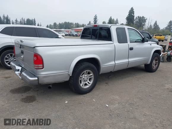 2004 Dodge Dakota SLT with VIN 1D7GL42K14S590088, listed as a IAAI auction lot 43106528 with 146,441 mi miles and . Bid and sale history available at DreamBid. Image 4.