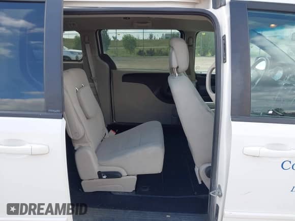 2012 Dodge Grand Caravan American Value z VIN 2C4RDGBG0CR190231, wystawiony jako IAAI lot #43140675 z przebiegiem 167 855 mil mil oraz . Historia ofert i sprzedaży dostępna na DreamBid. Obrazek 8.