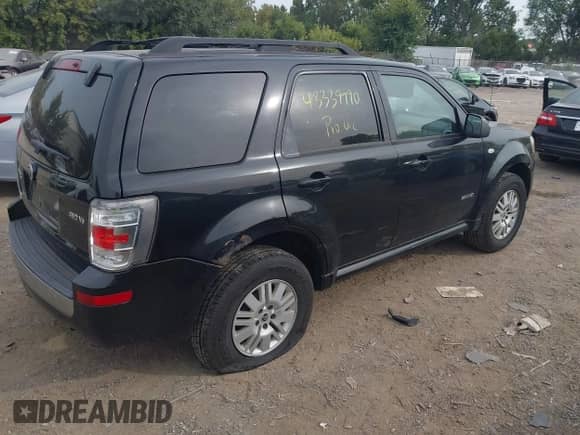 2008 Mercury Mariner with VIN 4M2CU91108KJ51427, listed as a IAAI auction lot 43339990 with 227,044 mi miles and . Bid and sale history available at DreamBid. Image 4.