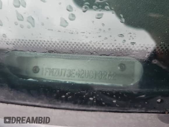 2002 Ford Explorer XLT with VIN 1FMZU73E42UC13262, listed as a Copart auction lot 86119365 with 217,906 mi miles and Salvage title. Bid and sale history available at DreamBid. Image 13.