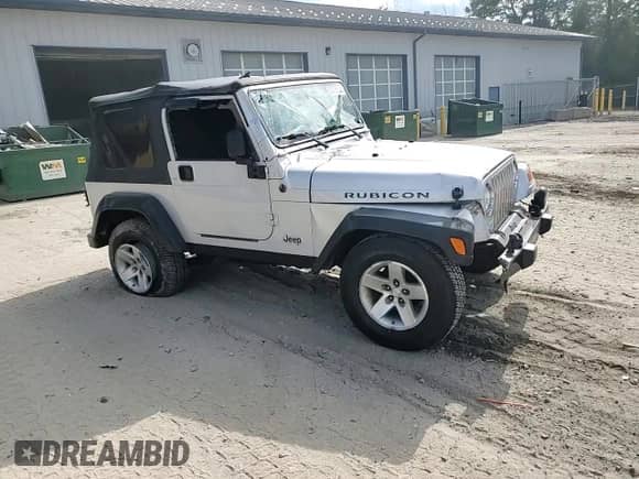 2003 Jeep Wrangler Rubicon с VIN 1J4FA69SX3P322715, выставлен на аукционе Copart как лот 63976635 с пробегом 167 842 миль миль и Списание • Salvage title. История ставок и продаж доступна на DreamBid. Изображение 13.