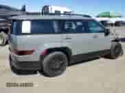 2025 Hyundai Santa Fe Calligraphy z VIN 5NMP54G11SH041603, wystawiony jako Copart lot #63857045 z przebiegiem 6 860 mil mil oraz Szkoda całkowita • Salvage title. Historia ofert i sprzedaży dostępna na DreamBid. Obrazek 3.