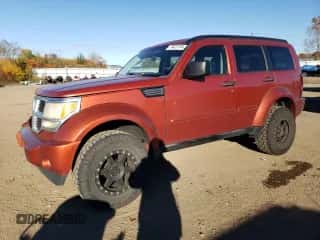 2009 Dodge Nitro SXT с VIN 1D8GU28K99W520973, выставлен на аукционе Copart как лот 77427114 с пробегом 242 803 миль миль и Списание • Salvage title. История ставок и продаж доступна на DreamBid. Изображение 1.
