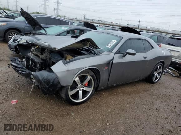 2012 Dodge Challenger SRT-8 392 с VIN 2C3CDYCJ9CH229723, выставлен на аукционе Copart как лот 55267885 с пробегом 62 056 миль миль и Списание • Salvage title. История ставок и продаж доступна на DreamBid. Изображение 1.