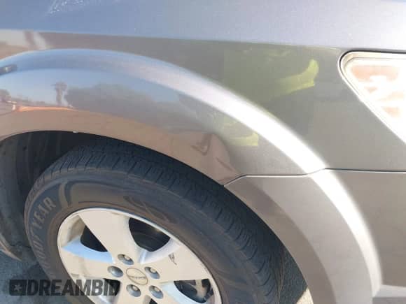 2013 Dodge Journey American Value z VIN 3C4PDCABXDT502219, wystawiony jako IAAI lot #43144633 z przebiegiem 166 589 mil mil oraz . Historia ofert i sprzedaży dostępna na DreamBid. Obrazek 6.