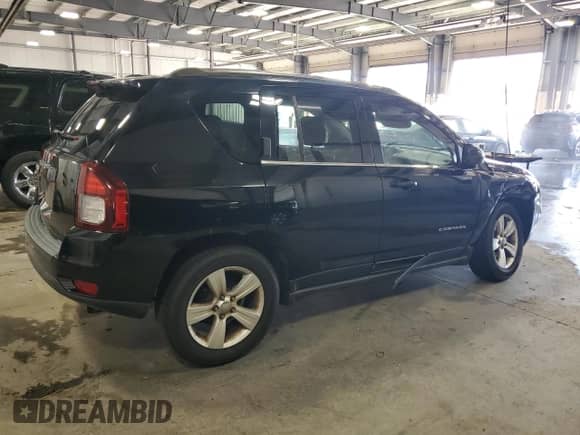 2014 Jeep Compass Sport with VIN 1C4NJDBB9ED842554, listed as a Copart auction lot 69468485 with 124,308 mi miles and Salvage title. Bid and sale history available at DreamBid. Image 3.