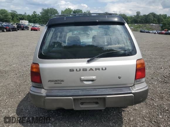 1999 Subaru Forester S with VIN JF1SF6557XH730701, listed as a Copart auction lot 65169235 with 142,246 mi miles and Salvage title. Bid and sale history available at DreamBid. Image 6.