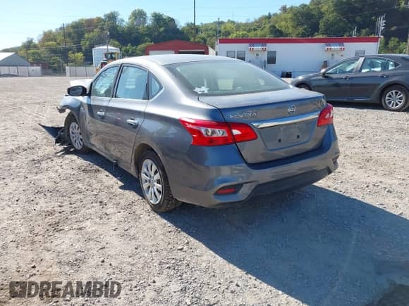 2019 Nissan Sentra S z VIN 3N1AB7AP9KY352427, wystawiony jako IAAI lot #43339948 z przebiegiem 100 002 mil mil oraz . Historia ofert i sprzedaży dostępna na DreamBid. Obrazek 3.