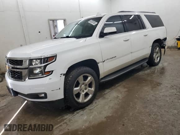 2015 Chevrolet Suburban LT with VIN 1GNSKJKC6FR635316, listed as a Copart auction lot 65336185 with 217,006 mi miles and Salvage title. Bid and sale history available at DreamBid. Image 1.