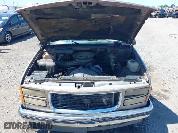 1994 GMC Sierra 1500 z VIN 2GTEC19K7R1555049, wystawiony jako IAAI lot #42316465 z przebiegiem 242 883 mil mil oraz . Historia ofert i sprzedaży dostępna na DreamBid. Obrazek 10.