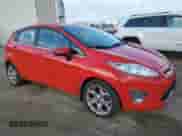 2012 Ford Fiesta SES with VIN 3FADP4FJ0CM174727, listed as a Copart auction lot 86832155 with 135,586 mi miles and Salvage title. Bid and sale history available at DreamBid. Image 4.