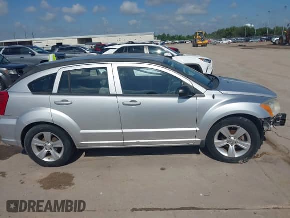 2010 Dodge Caliber SXT with VIN 1B3CB4HA7AD660883, listed as a IAAI auction lot 42270568 with 146,723 mi miles and . Bid and sale history available at DreamBid. Image 14.