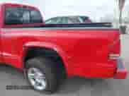 1999 Dodge Dakota SLT with VIN 1B7GL26Z5XS217114, listed as a IAAI auction lot 43418147 with 145,280 mi miles and . Bid and sale history available at DreamBid. Image 6.