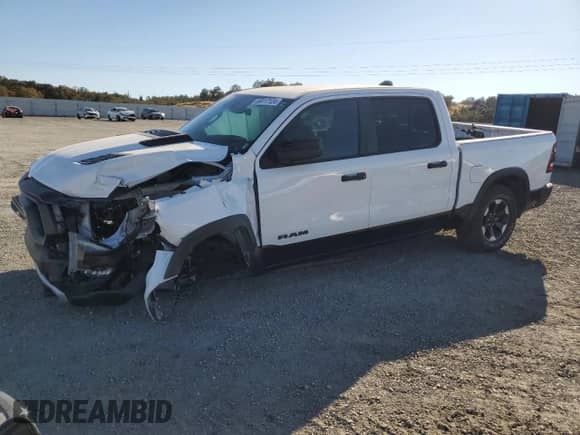 2022 Ram 1500 Rebel z VIN 1C6SRFLT4NN158883, wystawiony jako Copart lot #69117124 z przebiegiem 45 447 mil mil oraz Czysty tytuł • Clean title. Historia ofert i sprzedaży dostępna na DreamBid. Obrazek 1.