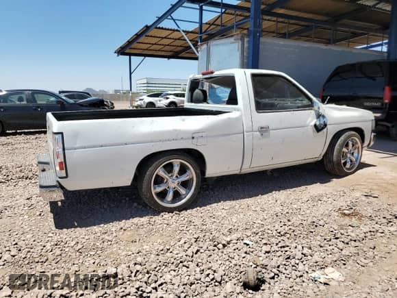 1995 Nissan Frontier with VIN 1N6SD11S7SC475209, listed as a Copart auction lot 67856375 with 246,193 mi miles and Salvage title. Bid and sale history available at DreamBid. Image 3.