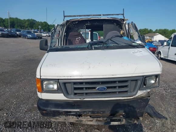 2006 Ford Econoline Cargo with VIN 1FTNE24W06HA21135, listed as a IAAI auction lot 42395308 with 302,529 mi miles and . Bid and sale history available at DreamBid. Image 12.