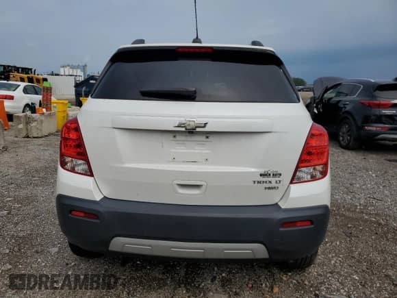 2015 Chevrolet Trax LT z VIN KL7CJRSB7FB111443, wystawiony jako Copart lot #69103095 z przebiegiem Nie podano mil oraz Szkoda całkowita • Salvage title. Historia ofert i sprzedaży dostępna na DreamBid. Obrazek 6.