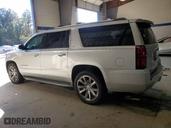 2015 Chevrolet Suburban LTZ with VIN 1GNSKKKC0FR230123, listed as a Copart auction lot 90385635 with 173,222 mi miles and Clean title. Bid and sale history available at DreamBid. Image 2.