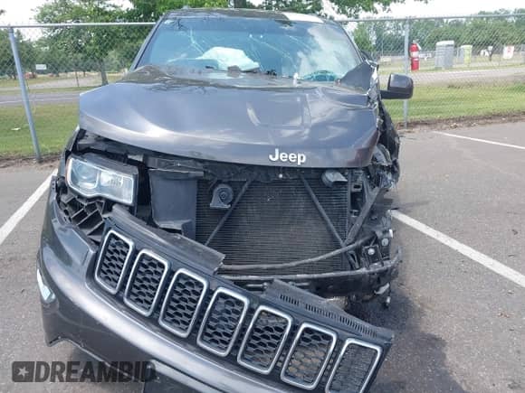 2020 Jeep Grand Cherokee Laredo E with VIN 1C4RJFAG9LC419986, listed as a IAAI auction lot 42610904 with 61,077 mi miles and . Bid and sale history available at DreamBid. Image 12.