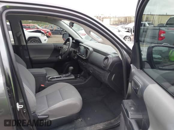 2023 Toyota Tacoma SR with VIN 3TMCZ5ANXPM538495, listed as a IAAI auction lot 42993850 with 41,728 mi miles and . Bid and sale history available at DreamBid. Image 5.