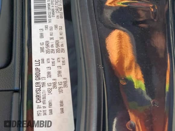 2014 Jeep Grand Cherokee Summit with VIN 1C4RJFJTXEC127795, listed as a Copart auction lot 58586945 with 124,181 mi miles and Salvage title. Bid and sale history available at DreamBid. Image 14.