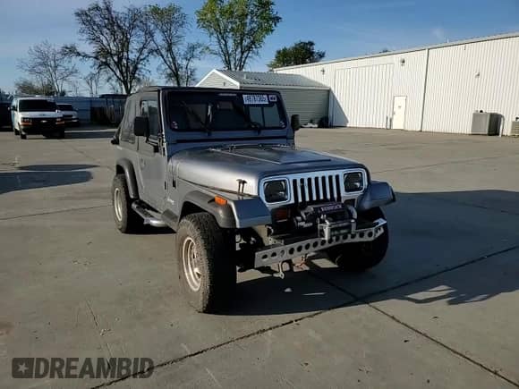 1993 Jeep Wrangler with VIN 1J4FY29S2PP242528, listed as a Copart auction lot 49787365 with 147,707 mi miles and Salvage title. Bid and sale history available at DreamBid. Image 12.