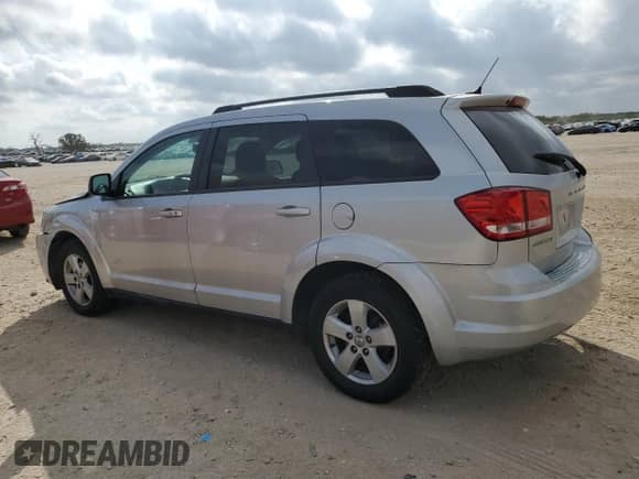 2012 Dodge Journey American Value with VIN 3C4PDCAB8CT184566, listed as a Copart auction lot 87305905 with 42,179 mi miles and Salvage title. Bid and sale history available at DreamBid. Image 2.