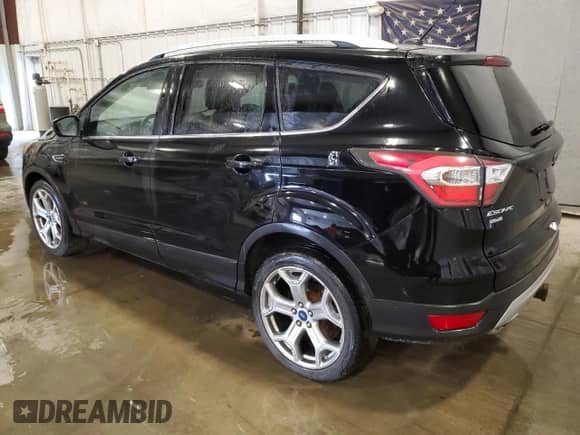 2017 Ford Escape Titanium with VIN 1FMCU9J92HUA64401, listed as a Copart auction lot 65155895 with 184,708 mi miles and Salvage title. Bid and sale history available at DreamBid. Image 2.