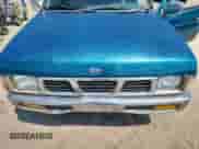 1995 Nissan Frontier with VIN 1N6SD11S3SC358078, listed as a Copart auction lot 71859815 with 118,833 mi miles and Salvage title. Bid and sale history available at DreamBid. Image 11.