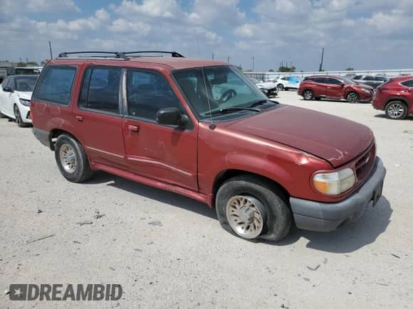 1999 Ford Explorer XL with VIN 1FMZU32X0XZB20762, listed as a Copart auction lot 73648134 with 142,158 mi miles and Salvage title. Bid and sale history available at DreamBid. Image 4.