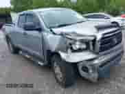 2012 Toyota Tundra z VIN 5TFRU5F14CX027982, wystawiony jako IAAI lot #42369647 z przebiegiem 169 286 mil mil oraz . Historia ofert i sprzedaży dostępna na DreamBid. Obrazek 1.