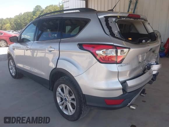 2018 Ford Escape SE with VIN 1FMCU9GDXJUC62452, listed as a IAAI auction lot 43119355 with 117,966 mi miles and . Bid and sale history available at DreamBid. Image 3.