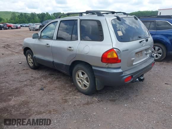 2003 Hyundai Santa Fe GLS with VIN KM8SC13D53U445931, listed as a IAAI auction lot 42453079 with 216,089 mi miles and . Bid and sale history available at DreamBid. Image 3.