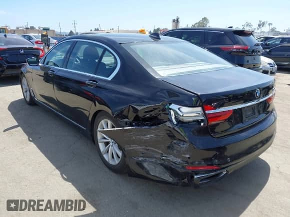 2019 BMW 7 Series 740i with VIN WBA7E2C56KB216989, listed as a IAAI auction lot 42336636 with 113,644 mi miles and . Bid and sale history available at DreamBid. Image 3.