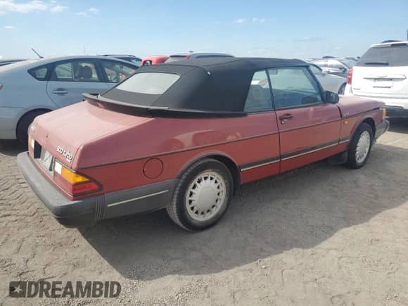 1990 Saab 900 with VIN YS3AL75LXL7013883, listed as a Copart auction lot 75400804 with 165,394 mi miles and Salvage title. Bid and sale history available at DreamBid. Image 3.