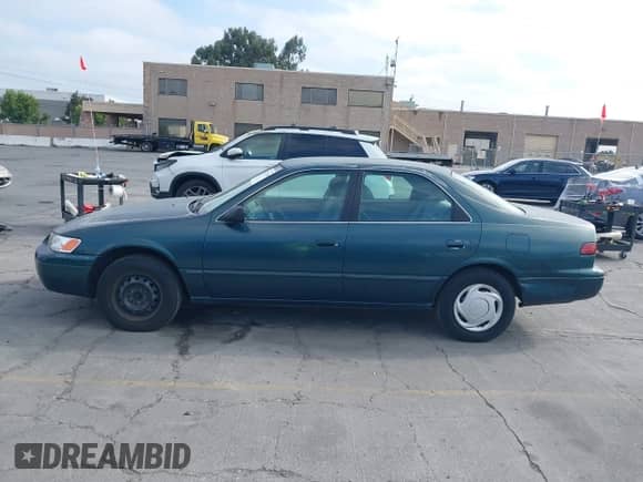 1997 Toyota Camry LE z VIN 4T1BG22K4VU018642, wystawiony jako IAAI lot #43272849 z przebiegiem 208 007 mil mil oraz . Historia ofert i sprzedaży dostępna na DreamBid. Obrazek 14.