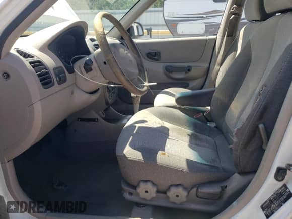 2002 Hyundai Accent GL z VIN KMHCG45C12U343720, wystawiony jako Copart lot #63329455 z przebiegiem 158 251 mil mil oraz Szkoda całkowita • Salvage title. Historia ofert i sprzedaży dostępna na DreamBid. Obrazek 7.