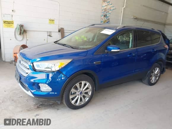 2017 Ford Escape Titanium with VIN 1FMCU9JD3HUA48471, listed as a IAAI auction lot 42686659 with 101,782 mi miles and . Bid and sale history available at DreamBid. Image 2.
