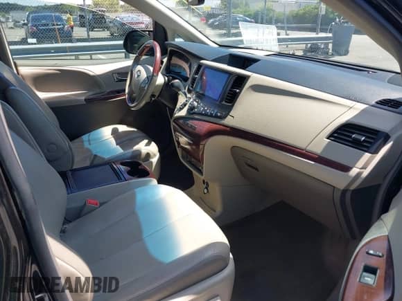 2013 Toyota Sienna XLE with VIN 5TDDK3DC0DS051969, listed as a IAAI auction lot 42344494 with 166,890 mi miles and . Bid and sale history available at DreamBid. Image 5.