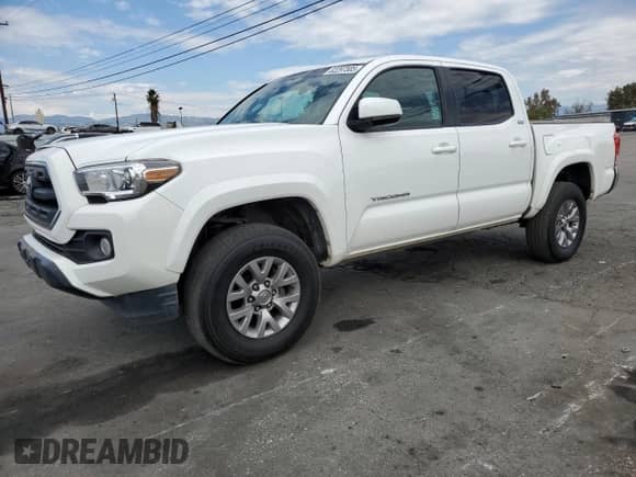 2016 Toyota Tacoma SR5 with VIN 5TFAX5GNXGX053627, listed as a Copart auction lot 82297585 with 80,982 mi miles and Salvage title. Bid and sale history available at DreamBid. Image 1.