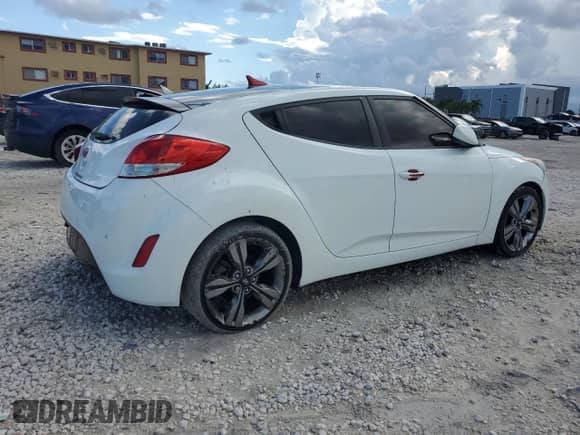 2014 Hyundai Veloster z VIN KMHTC6AD4EU194875, wystawiony jako Copart lot #84427235 z przebiegiem 127 813 mil mil oraz Szkoda całkowita • Salvage title. Historia ofert i sprzedaży dostępna na DreamBid. Obrazek 3.