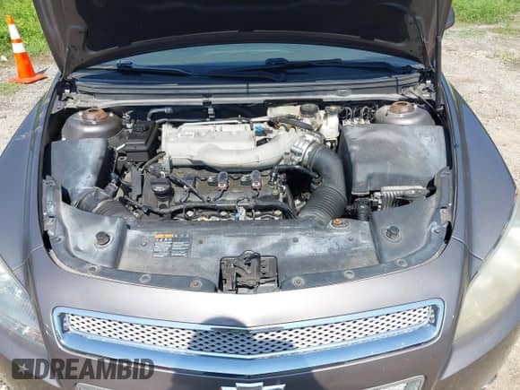 2012 Chevrolet Malibu LTZ z VIN 1G1ZG5E7XCF294023, wystawiony jako IAAI lot #42849791 z przebiegiem 99 989 mil mil oraz . Historia ofert i sprzedaży dostępna na DreamBid. Obrazek 10.