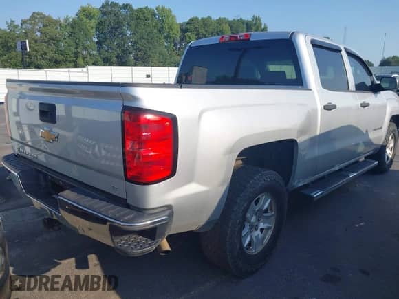 2014 Chevrolet Silverado 1500 LT with VIN 3GCPCREHXEG259073, listed as a IAAI auction lot 43010013 with 128,000 mi miles and . Bid and sale history available at DreamBid. Image 4.
