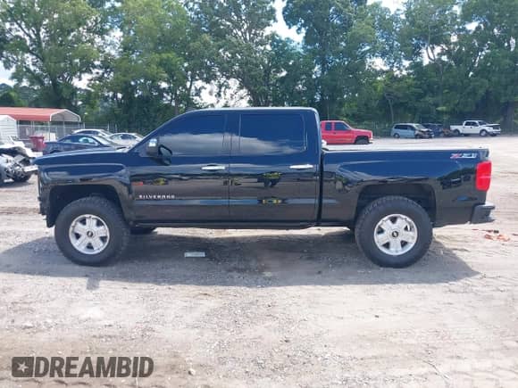 2014 Chevrolet Silverado 1500 LTZ with VIN 3GCUKSEC1EG311188, listed as a IAAI auction lot 42772149 with 141,404 mi miles and . Bid and sale history available at DreamBid. Image 15.